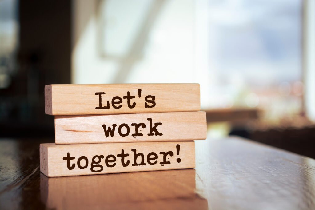 Wooden Blocks With Words 'let's Work Together'. Business Concept